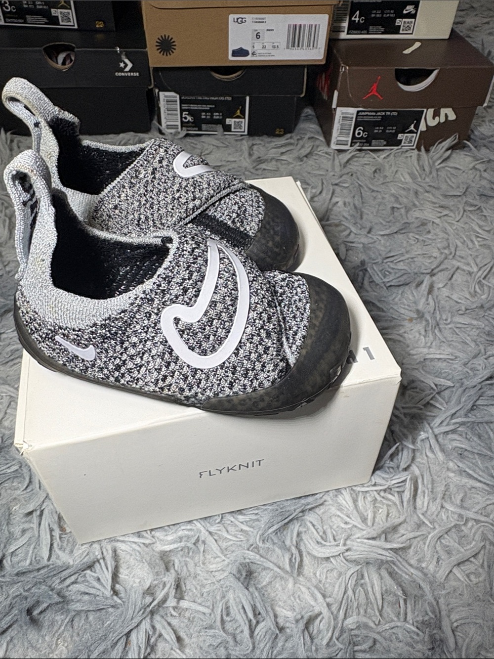 Nike Kids Black and Grey Flyknit Slip-On Sneakers